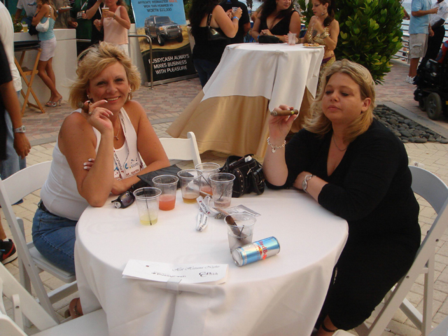 Carole and ImLive host, Dixie enjoy a couple of cigars by the pool